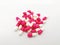 Medication and healthcare concept. Many white-pink capsules of A