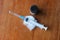 A medication vial and a syringe with needle on a cotton swab with a wooden background.