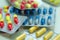 Medications and pills. Multicolored medicines on a light background close-up