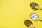 Medications vitamins tablets and pills in spoon. Yellow background. Copy of the space