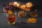 Medicinal herbal tea in a glass cup, ginger, walnut, turmeric, honey, lemon and dry rosehip berries