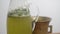 Medicinal herbal tincture, close-up, green water