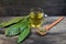 medicinal infusion of loquat leaves with honey, on rustic wooden background