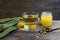 medicinal infusion of loquat leaves with honey, on rustic wooden background