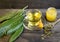 medicinal infusion of loquat leaves with honey, on rustic wooden background