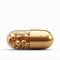 Medicinal opulence 3D gold medical pill, vitamins, isolated on white