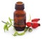 Medicinal Rose hips with essential oil in a glass bottle