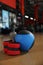 Medicine ball, bottle and weighting agents on floor in gym