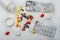 Medicine bottle, blister pack and pills closeup on white background