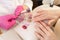 Medicine, cosmetology and manicure. Women in the salon choose the color of nail Polish on the manicure palette of varnishes. Hands