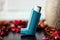 Medicine and health concept: Blue inhaler