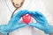 Medicine and healthcare concept. Heart In The Hands Of A Doctor. Cardiology and heart disease concept