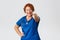 Medicine, healthcare and coronavirus concept. Cheerful smiling and enthusiastic middle-aged doctor, female redhead nurse