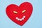 Medicine pills and Capsules on red heart shape from anthropomorphic face