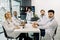 Medicine, science and people concept. Group of professional multiracial medical team, sitting at the table at medical