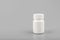 Medicine white pill bottle on grey background