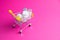 Medicines, drops in a metal trolley for a buyer from a supermarket on a pink paper background. The concept of medicine and the