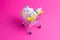 Medicines, drops in a metal trolley for a buyer from a supermarket on a pink paper background. The concept of medicine and the