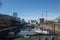 Medienhafen harbour with many boats and yachts anchor at pier, surrounded with modern contemporary architectures.