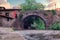 The medieval arch stone bridge of San Cayetano over the River Quiviesa in Potes