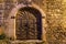 Medieval arched doors and windows in a village in Provence