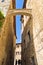 Medieval architecture of San Gimignano, towers and houses in narrow street, Tuscany