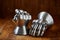 Medieval armor, detail of an ancient armor. Steel gloves on wooden background.