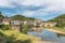 Medieval bridge over Lot with castle in village of Estaing