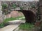 Medieval brown stone arch in the village of Prades, Tarragona, Spain, Europe