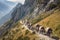 medieval caravan traveling along narrow mountain pass, with pack mules in the foreground