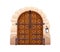Medieval castle double door in vintage style. Old ancient wooden entrance to palace. Closed locked entry, arched portal