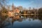 Medieval Castle on Love lake, Minnewater Park in Bruges, Belgium