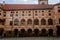 Medieval castle Melnik in sunny autumn day, Courtyard with Renaissance arcades, High clock tower of the Church of Saints Peter and