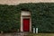 Medieval castle Melnik in sunny autumn day, ivy-covered entrance to the castle`s wine cellars, Central Bohemia, Czech republic