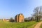 Medieval castle Slot Loevestein by earthen wall and moat at River Waal