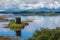 Medieval Castle Stalker reflecting on a scottish lake