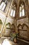 Medieval chapel with flowers on the stone altar