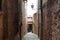 Medieval characteristic narrow street in the historical center of Montepuliciano city near Siena, Tuscany, Italy