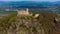 Medieval Chojnik Castle atop Karkonosze mountain in aerial shot