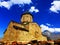 Medieval Church of the assumption on Kazbek mountain. Famous Gergeti Trinity Tsminda Sameba Church