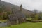 Medieval church of Glendalough in the fog, Ireland