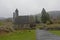 Medieval church of Glendalough in the fog, Ireland