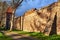 Medieval defensive walls with a tower in the city of Osno