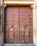 Medieval doors.  Spanish traditional ornament on wooden gates. Old wooden gate texture. Strong fortress