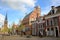 The medieval facade of Museum Martena and the clock tower of Martinikerk St Martin church