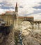 Medieval fantasy world, cathedral and bridge over a cliff. Valley with river. Gothic fortress. Castle. Aerial view