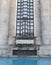 Medieval fountain with large window concept photo. Urban architectural photography.