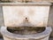 medieval fountain in old city wall in Brescia