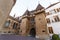 Medieval gated stone entrance to a town square