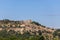 Medieval historic Lacoste village stands on hilltop of Little Luberon massif with ruins Marquis de Sade castle. Vaucluse, Provence